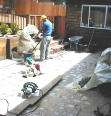 Cutting bricks for a custom paver patio