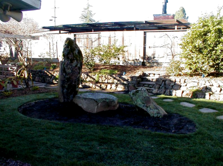 After- Boulders, Pavers, New Sod & Rock Retaining Wall